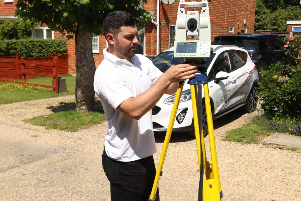 XP Surveys surveyor using precision geomatic surveying equipment